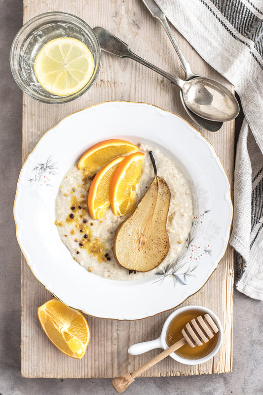 Oats with baked pear and orange and cinnamon syrup